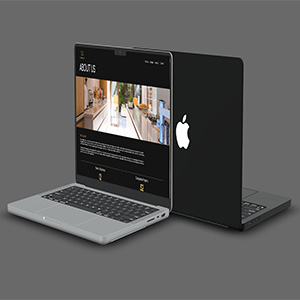 A photo of a MacBook Pro displaying a shot from the Custom Creations website.